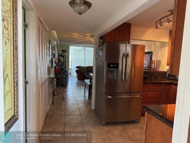 Beautiful water view updated 1 bedroom, 1  1/2  bath condo on Sunrise Lakes Phase III in Florida - for sale on GolfHomes.com, golf home, golf lot