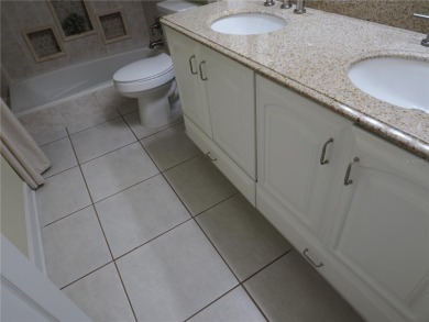 VACATION WHERE YOU LIVE... UNIQUE RARE OPPORTUNITY to own this on East Lake Woodlands Country Club in Florida - for sale on GolfHomes.com, golf home, golf lot