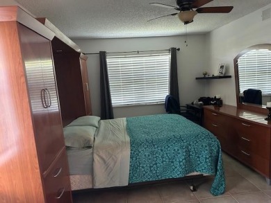 Beautiful water view updated 1 bedroom, 1  1/2  bath condo on Sunrise Lakes Phase III in Florida - for sale on GolfHomes.com, golf home, golf lot