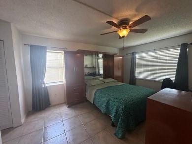 Beautiful water view updated 1 bedroom, 1  1/2  bath condo on Sunrise Lakes Phase III in Florida - for sale on GolfHomes.com, golf home, golf lot
