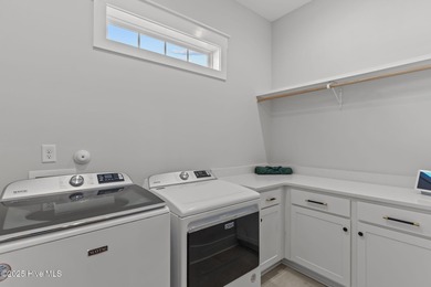 Welcome to this stunning residence nestled in the prestigious on Cape Fear National At Brunswick Forest in North Carolina - for sale on GolfHomes.com, golf home, golf lot