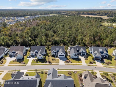 Welcome to this stunning residence nestled in the prestigious on Cape Fear National At Brunswick Forest in North Carolina - for sale on GolfHomes.com, golf home, golf lot