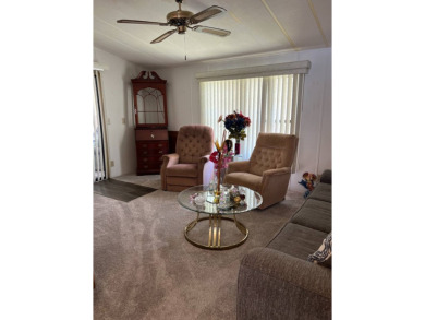 Welcome to this beautifully maintained 2/2 home where you will on Lake Henry Golf Club in Florida - for sale on GolfHomes.com, golf home, golf lot