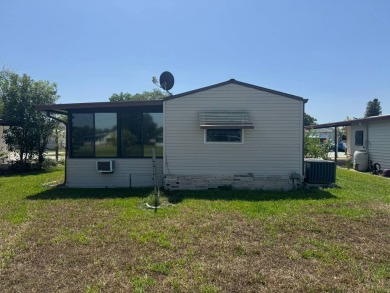 Here's a little slice a peace and happiness! Located on a on Golden Lakes Golf Course in Florida - for sale on GolfHomes.com, golf home, golf lot