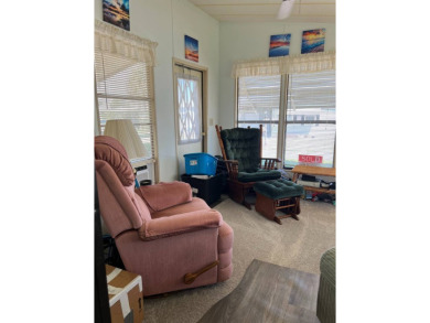 Welcome to this beautifully maintained 2/2 home where you will on Lake Henry Golf Club in Florida - for sale on GolfHomes.com, golf home, golf lot