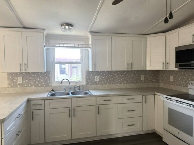 Here's a little slice a peace and happiness! Located on a on Golden Lakes Golf Course in Florida - for sale on GolfHomes.com, golf home, golf lot