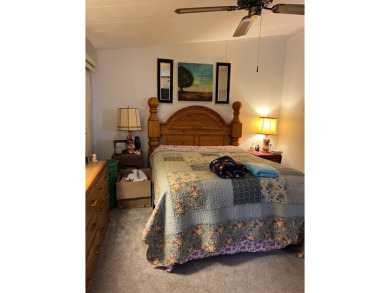 Welcome to this beautifully maintained 2/2 home where you will on Lake Henry Golf Club in Florida - for sale on GolfHomes.com, golf home, golf lot