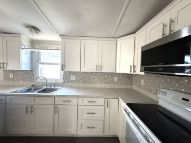 Here's a little slice a peace and happiness! Located on a on Golden Lakes Golf Course in Florida - for sale on GolfHomes.com, golf home, golf lot