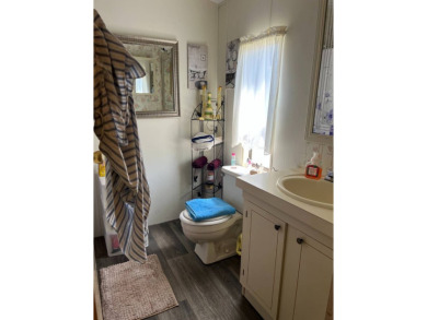 Welcome to this beautifully maintained 2/2 home where you will on Lake Henry Golf Club in Florida - for sale on GolfHomes.com, golf home, golf lot