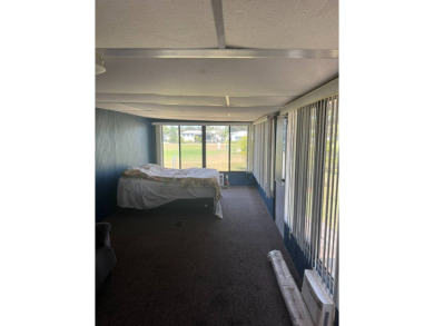 Here's a little slice a peace and happiness! Located on a on Golden Lakes Golf Course in Florida - for sale on GolfHomes.com, golf home, golf lot