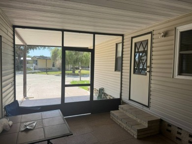 Here's a little slice a peace and happiness! Located on a on Golden Lakes Golf Course in Florida - for sale on GolfHomes.com, golf home, golf lot