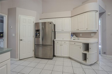 Spacious 3-bedroom, 3-bath home on nearly half an acre with on Silverado Golf and Country Club in Florida - for sale on GolfHomes.com, golf home, golf lot