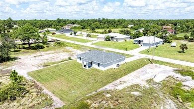 BRAND NEW CONSTRUCTION ON AN OVERSIZED LOT WITH SPINKLERS! You on Mirror Lakes Golf Club in Florida - for sale on GolfHomes.com, golf home, golf lot