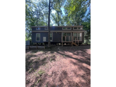 Have you been dreaming having your own permanent campsite?  Look on Voyager Village Country Club - Voyager in Wisconsin - for sale on GolfHomes.com, golf home, golf lot