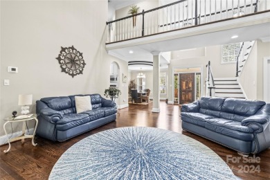 Located on a picturesque, park-like lot, this beautiful custom on Westport Golf Club in North Carolina - for sale on GolfHomes.com, golf home, golf lot