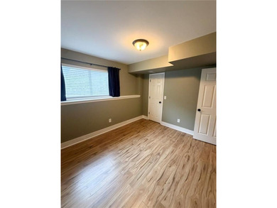 Welcome to this charming split-level home, perfectly suited for on The Deuce At the National Golf Club of Kansas City in Missouri - for sale on GolfHomes.com, golf home, golf lot