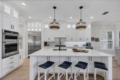 Welcome to an exceptional residence in the heart of University on University Park Country Club in Florida - for sale on GolfHomes.com, golf home, golf lot