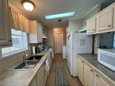 IF YOU ARE LOOKING FOR A 2 BEDROOMN 2 BATH IN MOVE-IN CONDITION on Southport Springs Golf Club in Florida - for sale on GolfHomes.com, golf home, golf lot