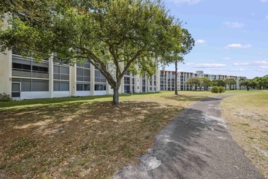 Light, bright, & timelessly renovated 2-bed, 2-bath, 1st-floor on Poinciana Golf Club in Florida - for sale on GolfHomes.com, golf home, golf lot