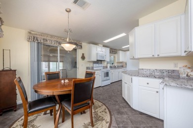 Enjoy peaceful water views and your own Mango Tree from this on Savanna Golf Club in Florida - for sale on GolfHomes.com, golf home, golf lot