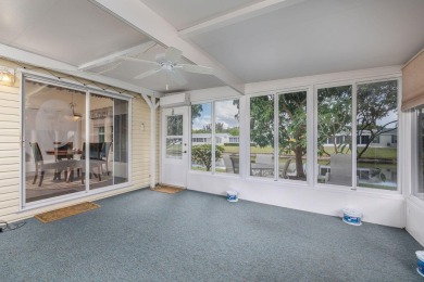 Enjoy peaceful water views and your own Mango Tree from this on Savanna Golf Club in Florida - for sale on GolfHomes.com, golf home, golf lot