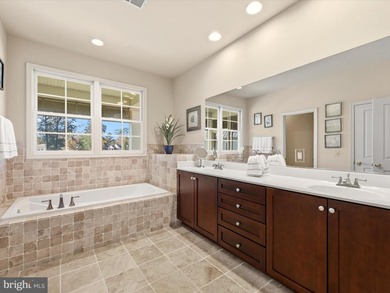 Welcome to 27444 S. Nicklaus Avenue, a refined coastal retreat on The Peninsula Golf and Country Club in Delaware - for sale on GolfHomes.com, golf home, golf lot