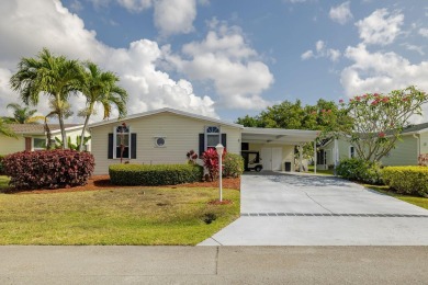 Enjoy peaceful water views and your own Mango Tree from this on Savanna Golf Club in Florida - for sale on GolfHomes.com, golf home, golf lot