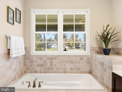 Welcome to 27444 S. Nicklaus Avenue, a refined coastal retreat on The Peninsula Golf and Country Club in Delaware - for sale on GolfHomes.com, golf home, golf lot