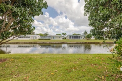 Enjoy peaceful water views and your own Mango Tree from this on Savanna Golf Club in Florida - for sale on GolfHomes.com, golf home, golf lot