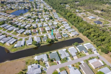 Enjoy peaceful water views and your own Mango Tree from this on Savanna Golf Club in Florida - for sale on GolfHomes.com, golf home, golf lot
