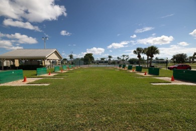 Enjoy peaceful water views and your own Mango Tree from this on Savanna Golf Club in Florida - for sale on GolfHomes.com, golf home, golf lot