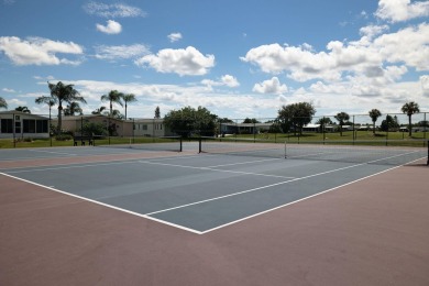 Enjoy peaceful water views and your own Mango Tree from this on Savanna Golf Club in Florida - for sale on GolfHomes.com, golf home, golf lot