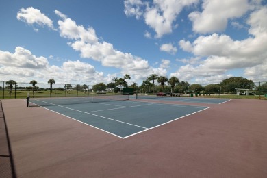 Enjoy peaceful water views and your own Mango Tree from this on Savanna Golf Club in Florida - for sale on GolfHomes.com, golf home, golf lot
