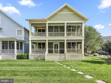 Welcome to 27444 S. Nicklaus Avenue, a refined coastal retreat on The Peninsula Golf and Country Club in Delaware - for sale on GolfHomes.com, golf home, golf lot
