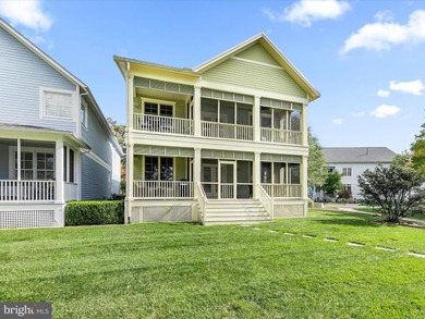 Welcome to 27444 S. Nicklaus Avenue, a refined coastal retreat on The Peninsula Golf and Country Club in Delaware - for sale on GolfHomes.com, golf home, golf lot