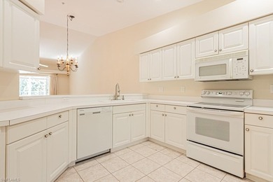 Welcome to this beautifully maintained second-floor veranda on Naples Heritage Golf and Country Club in Florida - for sale on GolfHomes.com, golf home, golf lot