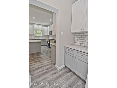 COMPLETELY RENOVATED & MOVE-IN READY! This STUNNING 4bd/2.5ba on Country Club of the Poconos Golf Course in Pennsylvania - for sale on GolfHomes.com, golf home, golf lot