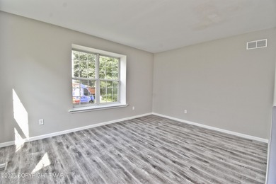 COMPLETELY RENOVATED & MOVE-IN READY! This STUNNING 4bd/2.5ba on Country Club of the Poconos Golf Course in Pennsylvania - for sale on GolfHomes.com, golf home, golf lot