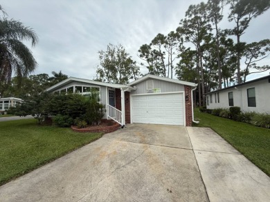 This beautiful 2-bedroom, 2-bathroom Palm Harbor home is being on Del Tura Golf and Country Club in Florida - for sale on GolfHomes.com, golf home, golf lot
