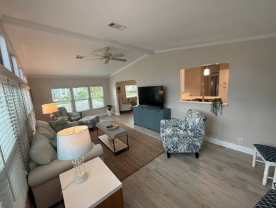 This beautiful 2-bedroom, 2-bathroom Palm Harbor home is being on Del Tura Golf and Country Club in Florida - for sale on GolfHomes.com, golf home, golf lot
