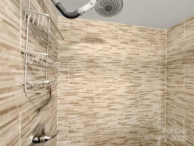 Discover comfort & style in this spacious bottom-level condo on Waynesville Country Club Inn in North Carolina - for sale on GolfHomes.com, golf home, golf lot