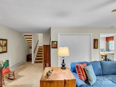 Discover comfort & style in this spacious bottom-level condo on Waynesville Country Club Inn in North Carolina - for sale on GolfHomes.com, golf home, golf lot