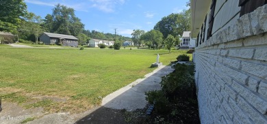 Charming and move-in ready, this  single-level ranch home is on Whittle Springs Golf Course in Tennessee - for sale on GolfHomes.com, golf home, golf lot