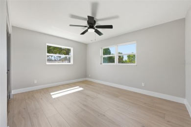 Welcome to this beautifully remodeled 3 bedroom, 2 bathroom pool on Mangrove Bay Golf Course in Florida - for sale on GolfHomes.com, golf home, golf lot