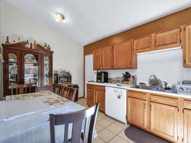 This tri-level home is ideally situated on Hole No. 1 of Willow on Willow Pond Golf Course in Illinois - for sale on GolfHomes.com, golf home, golf lot