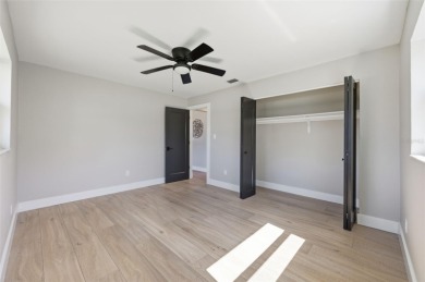 Welcome to this beautifully remodeled 3 bedroom, 2 bathroom pool on Mangrove Bay Golf Course in Florida - for sale on GolfHomes.com, golf home, golf lot
