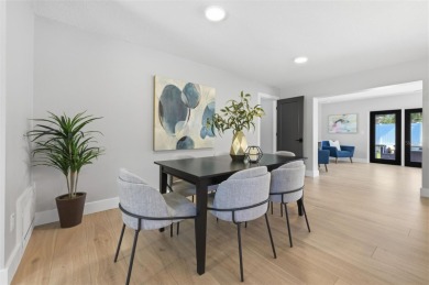 Welcome to this beautifully remodeled 3 bedroom, 2 bathroom pool on Mangrove Bay Golf Course in Florida - for sale on GolfHomes.com, golf home, golf lot