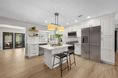 Welcome to this beautifully remodeled 3 bedroom, 2 bathroom pool on Mangrove Bay Golf Course in Florida - for sale on GolfHomes.com, golf home, golf lot