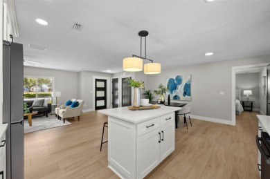 Welcome to this beautifully remodeled 3 bedroom, 2 bathroom pool on Mangrove Bay Golf Course in Florida - for sale on GolfHomes.com, golf home, golf lot