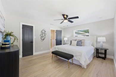 Welcome to this beautifully remodeled 3 bedroom, 2 bathroom pool on Mangrove Bay Golf Course in Florida - for sale on GolfHomes.com, golf home, golf lot